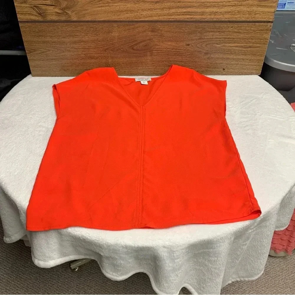 Rachel Zoe bright orange blouse size Small bold seam down the front